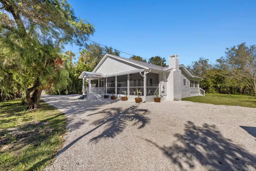 White house with gravel driveway