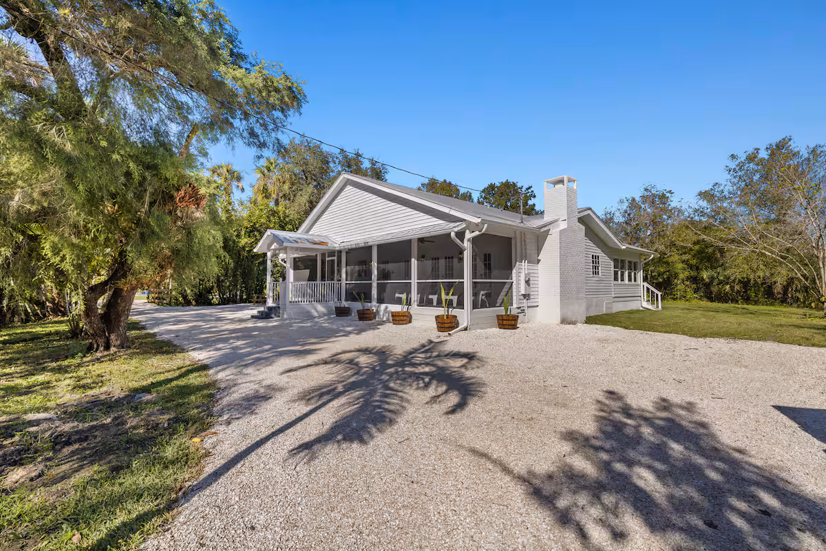 White house with gravel driveway