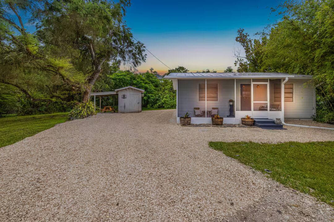 Cottage with outdoor storage shed
