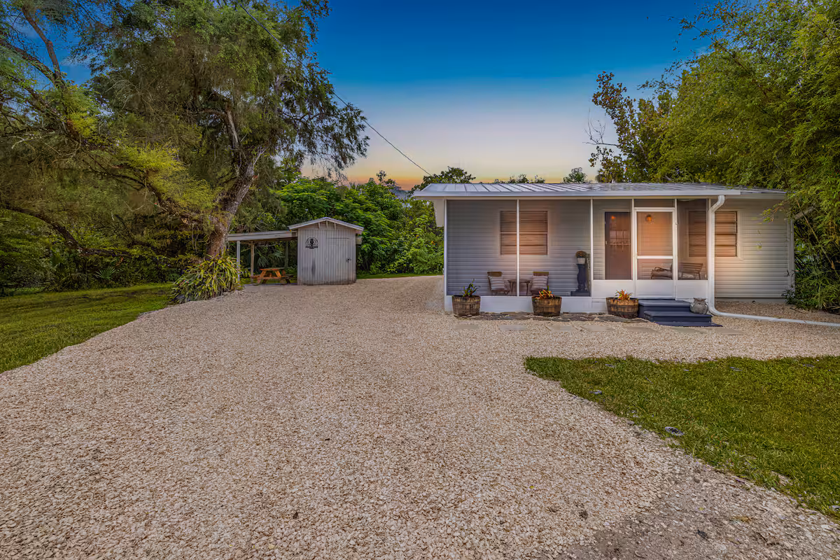Cottage with outdoor storage shed